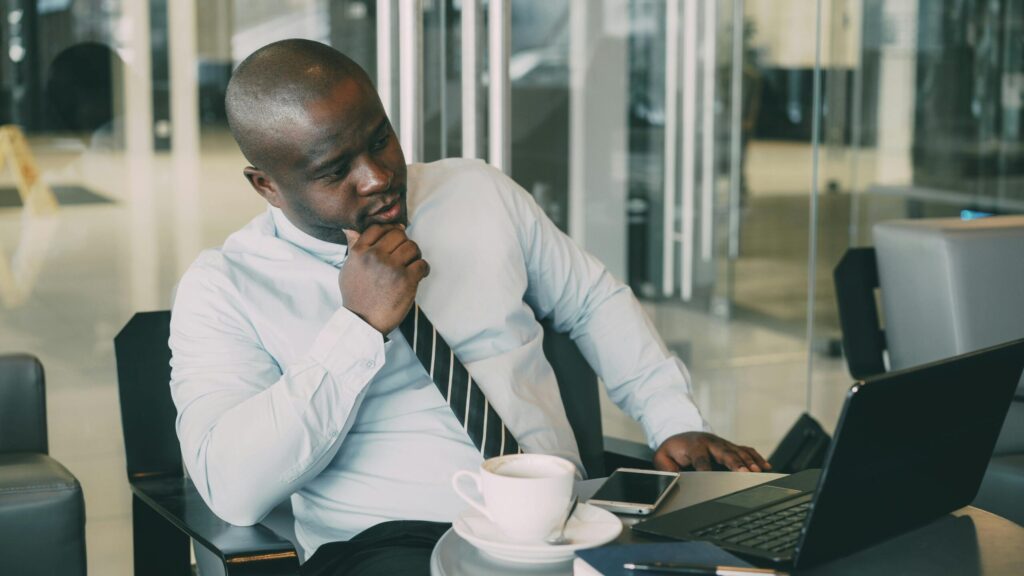 Man looking at computer in distress