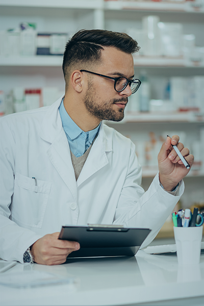 Pharmacy technician reviewing records