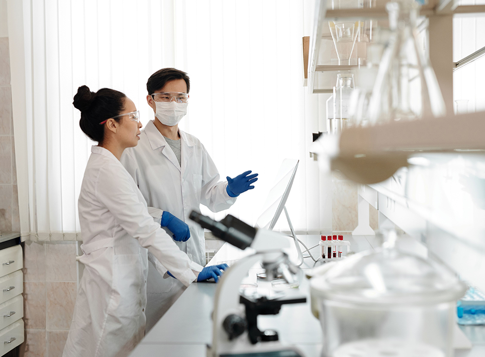 Pharmacists working in compounding lab