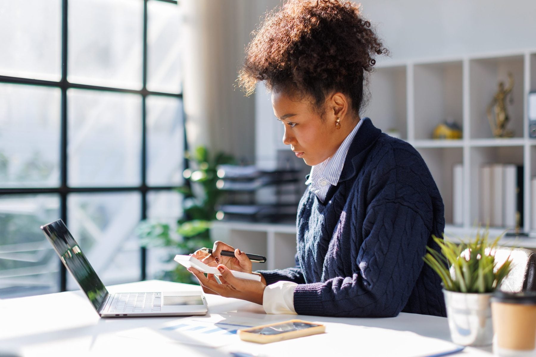 Systems analyst working with HCP data at a desk
