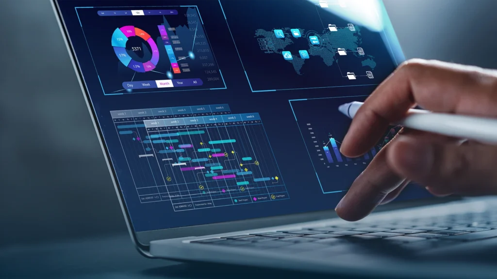Laptop showing compliance reporting dashboards and a project timeline