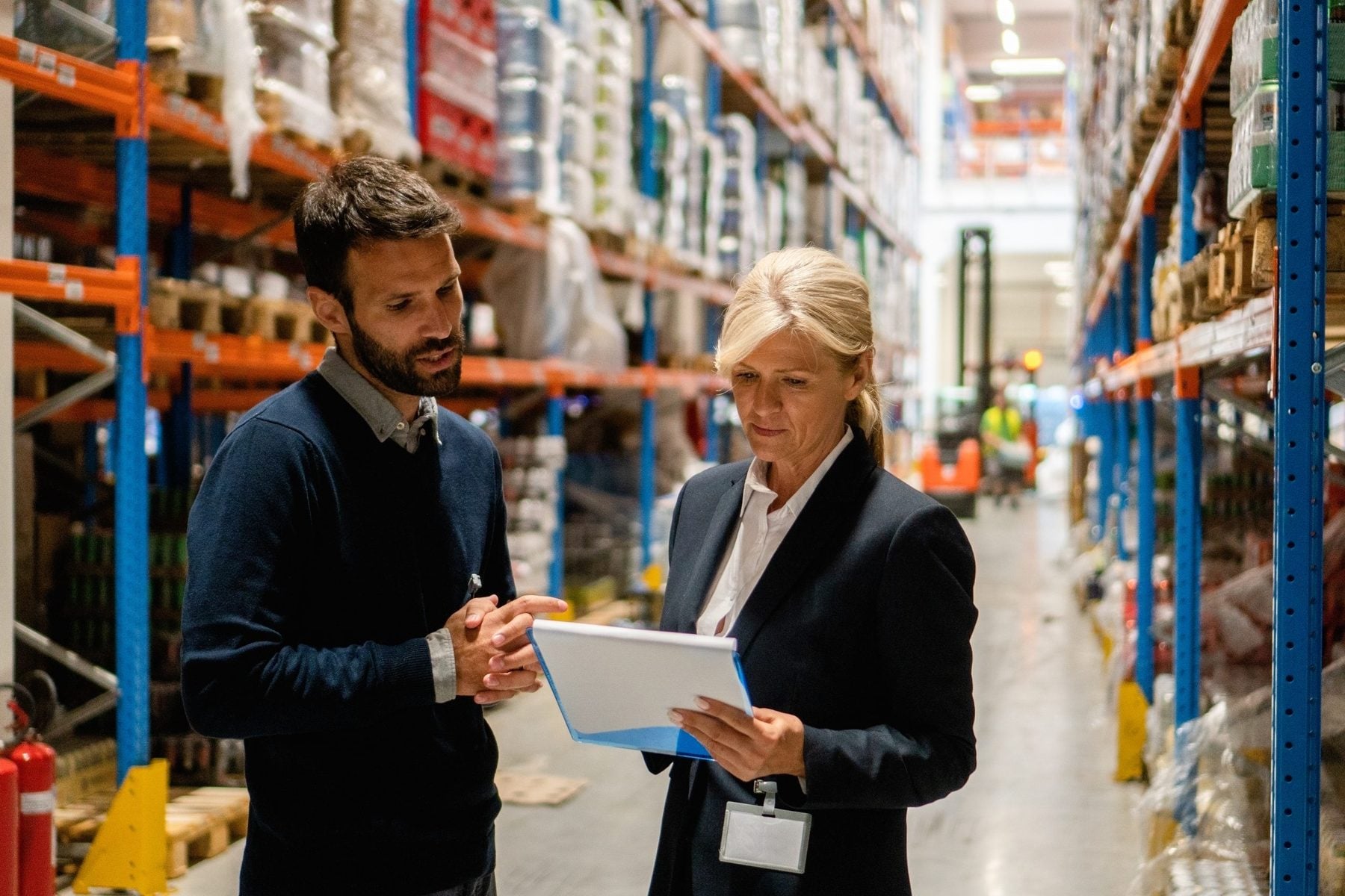 Distribution coordinator reviewing ship-to records in a warehouse