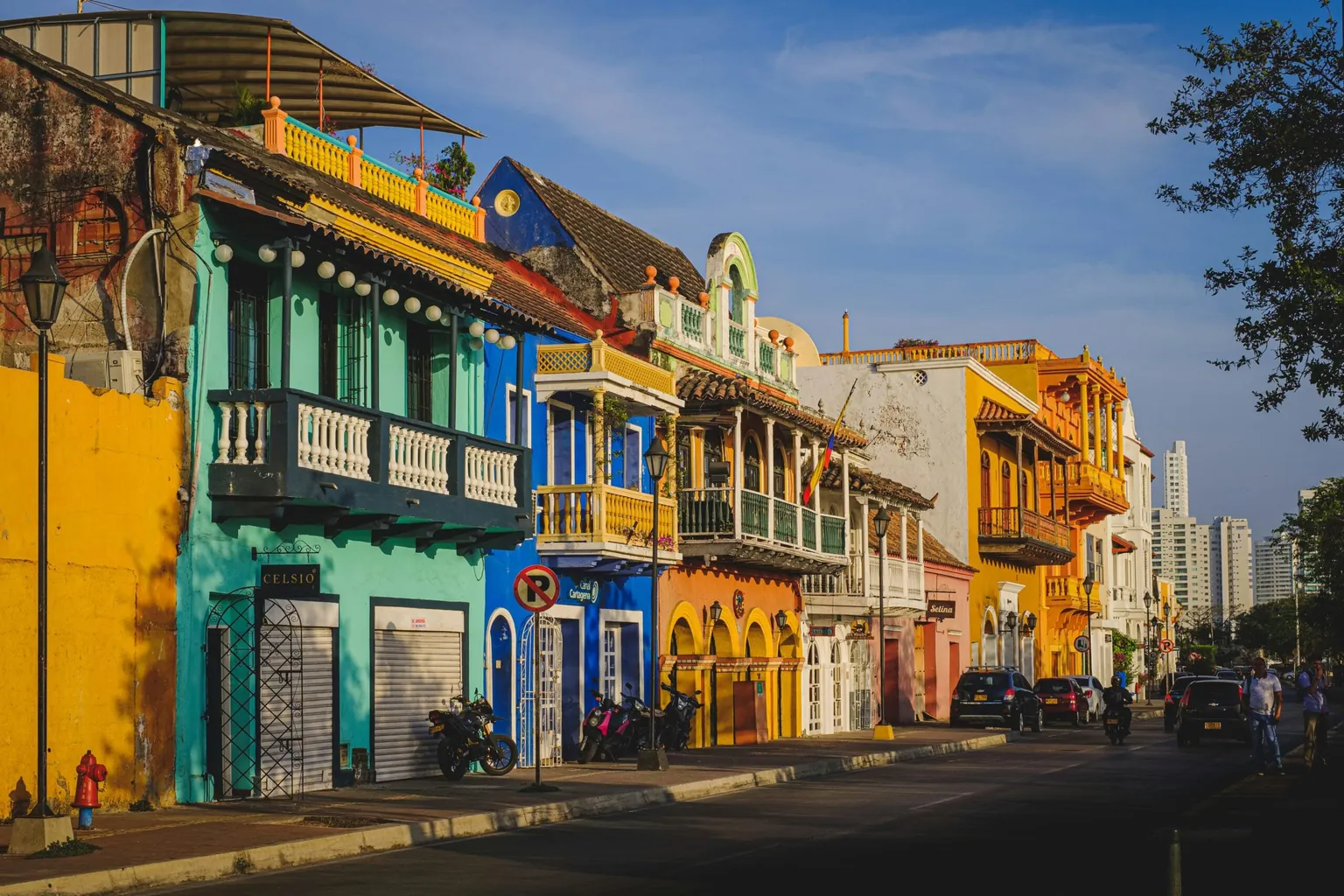 Colorful colonial buildings with balconies along a street in Colombia