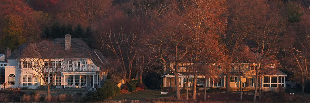 Waterfront homes among autumn trees in Connecticut