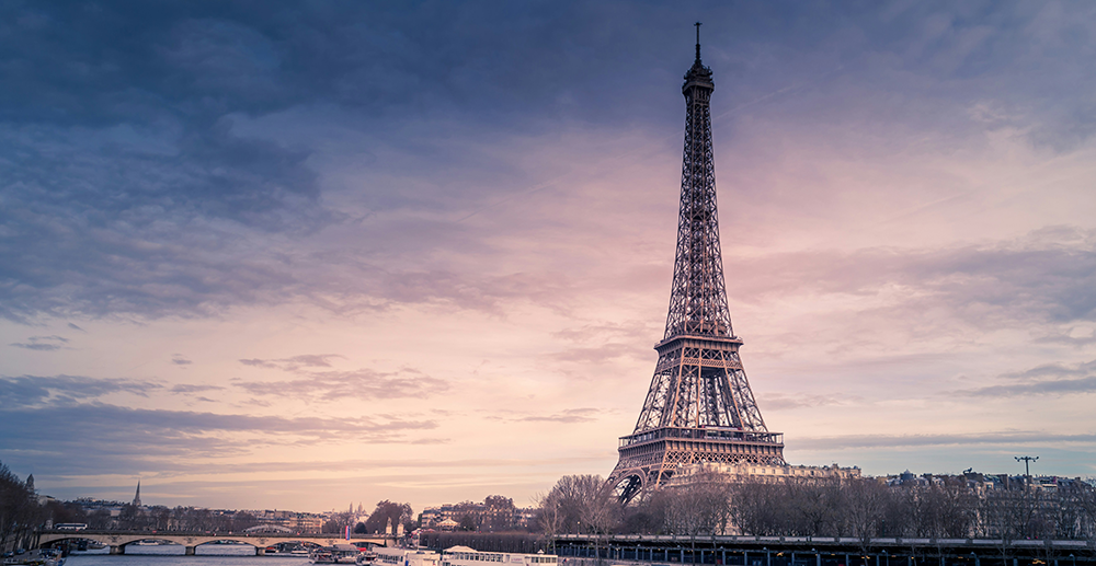Eiffel Tower above the Seine in Paris at dusk