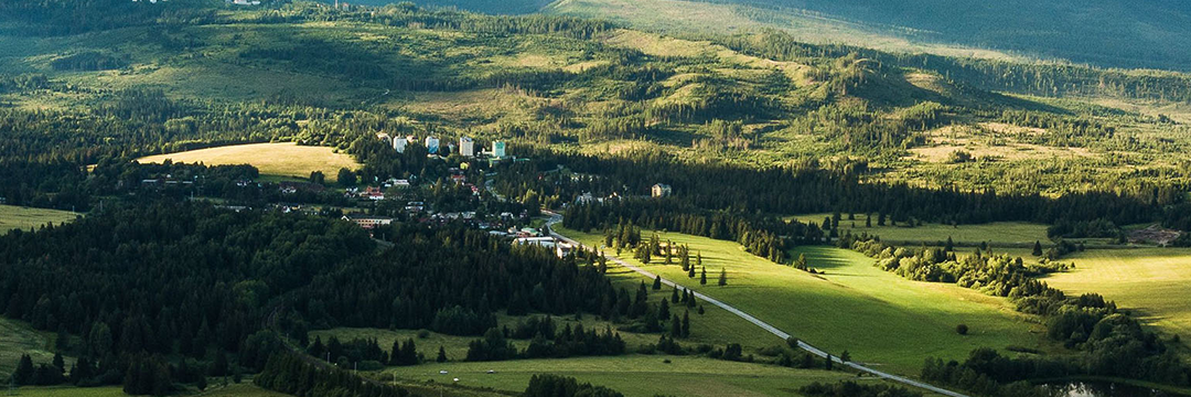 Green hills and forest around a small town in Slovakia