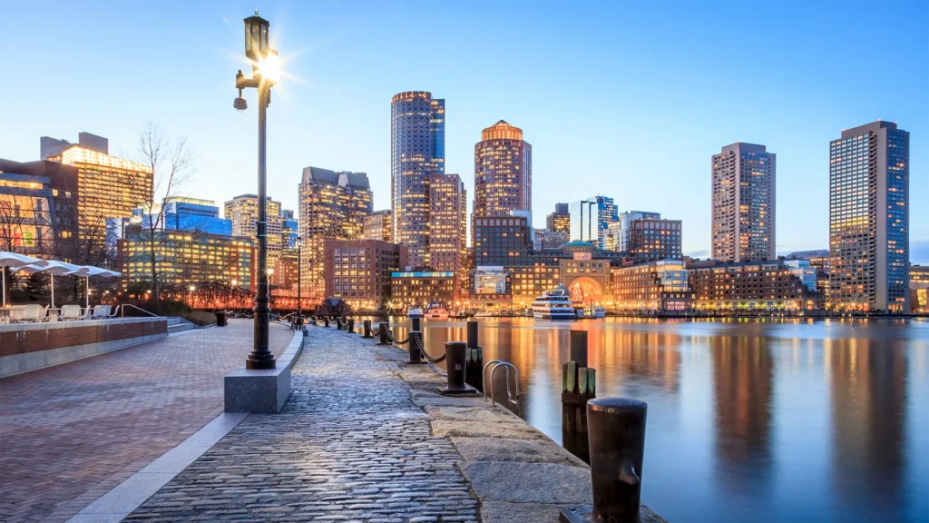 Boston skyline across the harbor at dusk